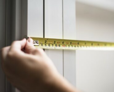 Man measuring ready to measure windows